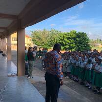 Volunteer addressing children