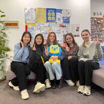 Staff and students with our mascot, Lex the Lion