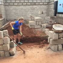 Construction volunteers working on the foundations of the classroom