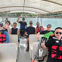 Academic leaders and support staff aboard a boat
