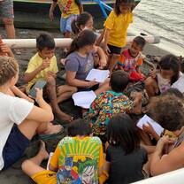 Learning session on the beach with school children facilitated by volunteers