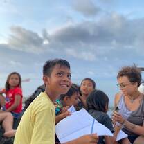 Learning session on the beach with school children facilitated by volunteers