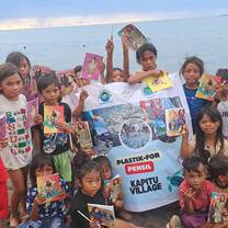 Learning session on the beach with school children facilitated by volunteers