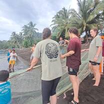 Learning to help their parents pull fishing nets with joy