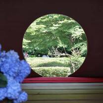 Japanese round window with garden in the back