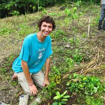 Reforestation Intern Planting Trees