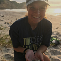 Student Holding Sea Turtle Hatchling
