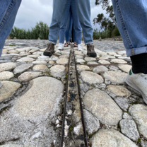 Students Standing Over Equator Line