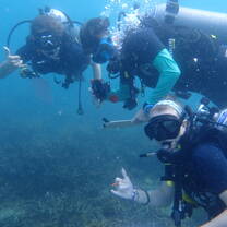 a group of divers pose for a photo