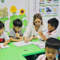 Xplore Cambodia Teacher with students