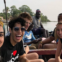 students on a boat in the Sine Saloum delta of Senegal 