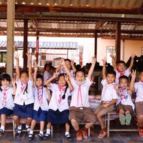 Kids raising their hands