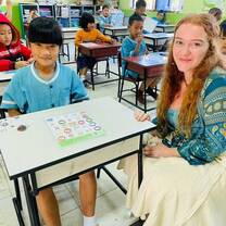 volunteer with student in the classroom