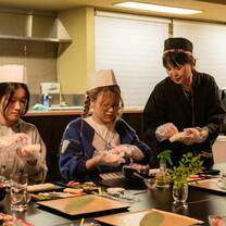 EF students practicing the art of sushi making
