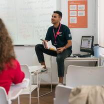 EF faculty engaged with students in a personalized classroom setting