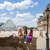 A group of high school EF language year abroad students exploring the Louvre