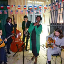 Students playing music at an event in Aix
