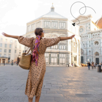 Woman with arms wide open in the city