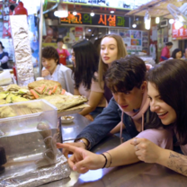 EF students trying new food from the local markets