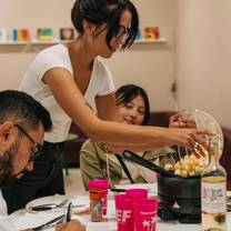 EF language year abroad students making a late night snack of fondue while studying