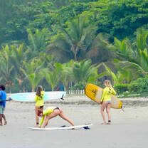 a group of volunteers getting ready to surf
