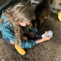 TCS Intern Feeding Goats