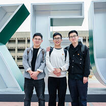 Students group photo at KFUBM sign