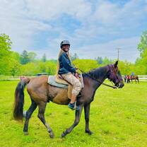 Camp USA participant riding a horse