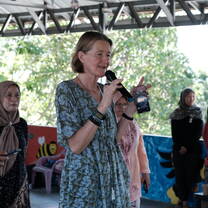 A volunteer leading a community event