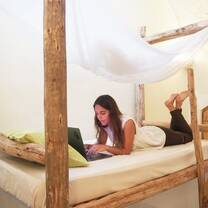 Volunteer in her wooden bunk bed
