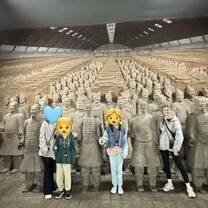 Au pair visiting Terracotta warriors in Xi'an with her host family