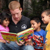 Volunteer reading to kids