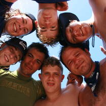 Coral Divers interns heads in a circle from below