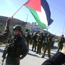 Waving the Palestinian flag to promote peace.