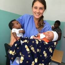 Me at the hospital with two newborn babies