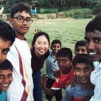After playing volleyball with local boys, they want me to take a selfie with them.