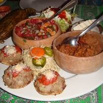 Volunteer in Oaxaca Mexico enjoying a homemade meal with a local family during the program