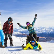 skiiers and snowboarders laughing