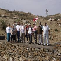 Volunteer stand on a completed anicut (small dam)
