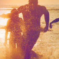 Running on beach at sunset
