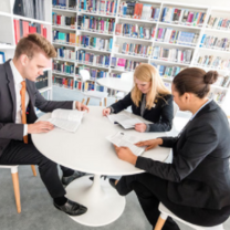 Master's students studying in library