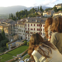 Student looking out on buildings in Italy