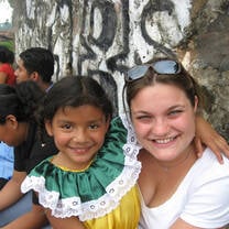 Volunteer with a young girl in El Salvador