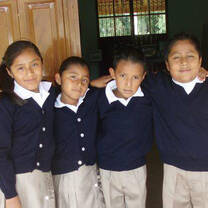 Volunteer with children in Mexico with FFHM