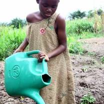 A child filling water in Ghana