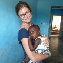 Volunteer with an orphan in Togo