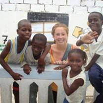 High school volunteers with Senegalese children