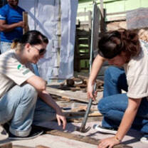 High school volunteers in South Africa working on a rebuilding project