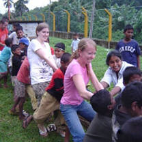 High school volunteers working with children in Sri Lanka