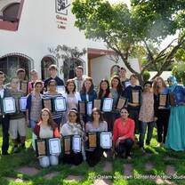 Students at Qalam Center for Arabic Studies pose with certification on campus